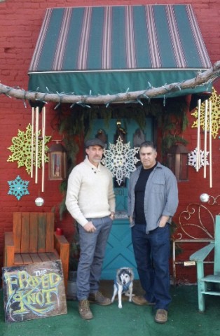 Tad Eaton  and Chris Morelli in front of thier furniture and bric-a-brac emporium in Hoboken, NJ