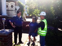 Bayonne Mayor Mark Smith talk with PSE&G representatives at site of broken watermain pipe on 5th street in Bayonne 